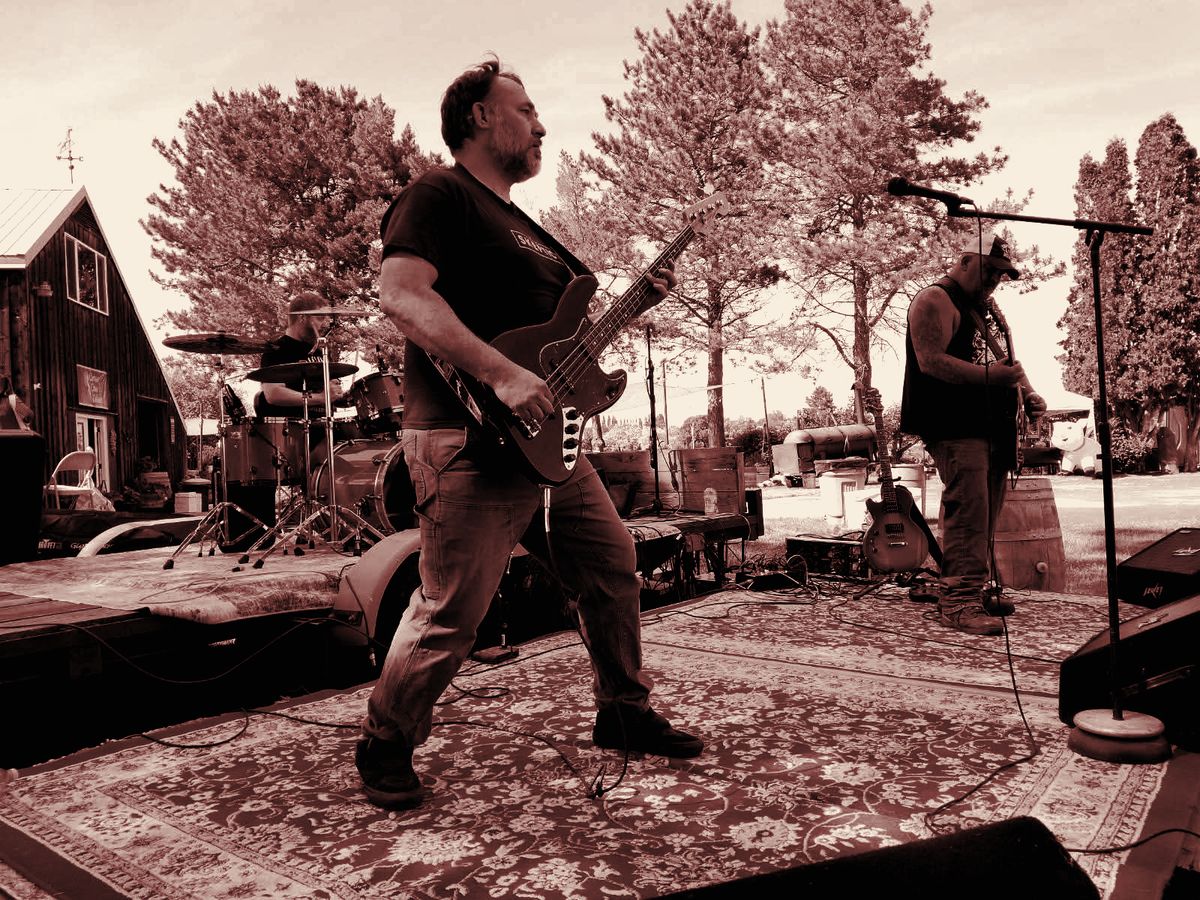 High Strangeness playing an outdoor stage, bass up front